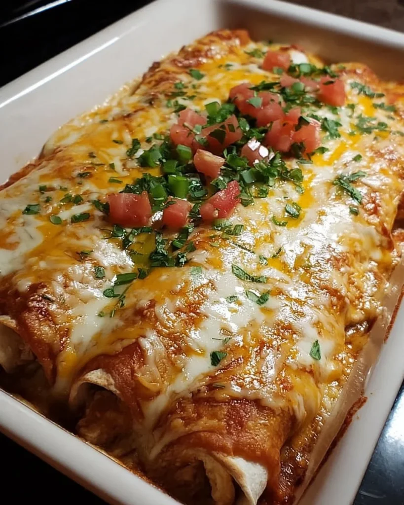 Cheese Chicken Enchiladas topped with melted cheese and fresh cilantro