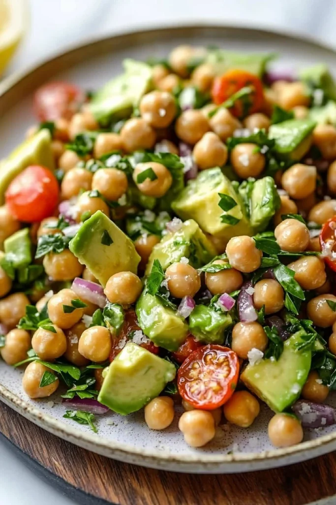 Chickpea avocado salad with lemon dressing in a bowl