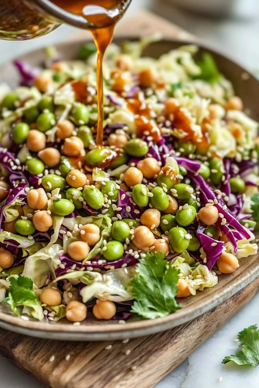 Chickpea edamame cabbage salad drizzled with sesame dressing