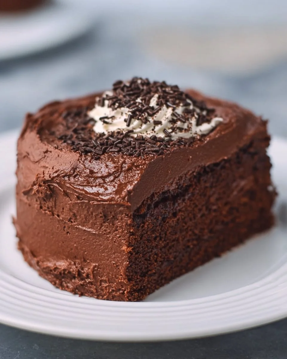 Delicious Chocolate Protein Cake topped with chocolate chips and nuts