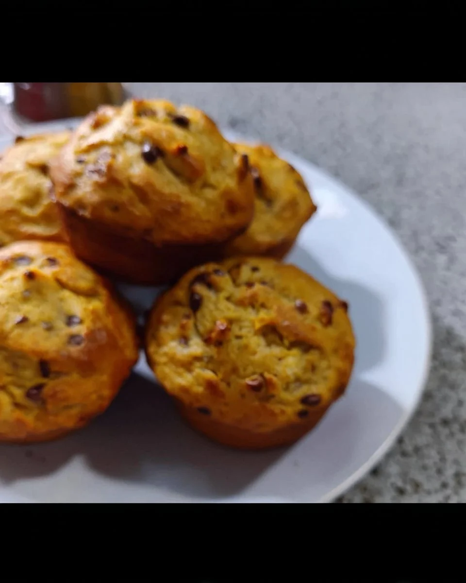 Delicious Greek Yogurt Protein Muffins on a rustic table.