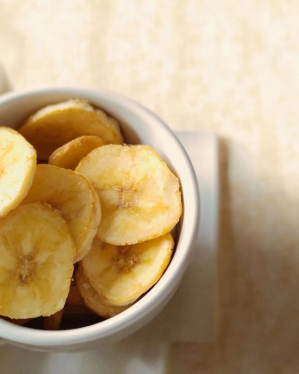 Bowl of homemade banana chips for a healthy snack option