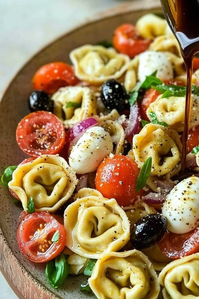 Colorful Italian Tortellini Pasta Salad with vegetables and dressing