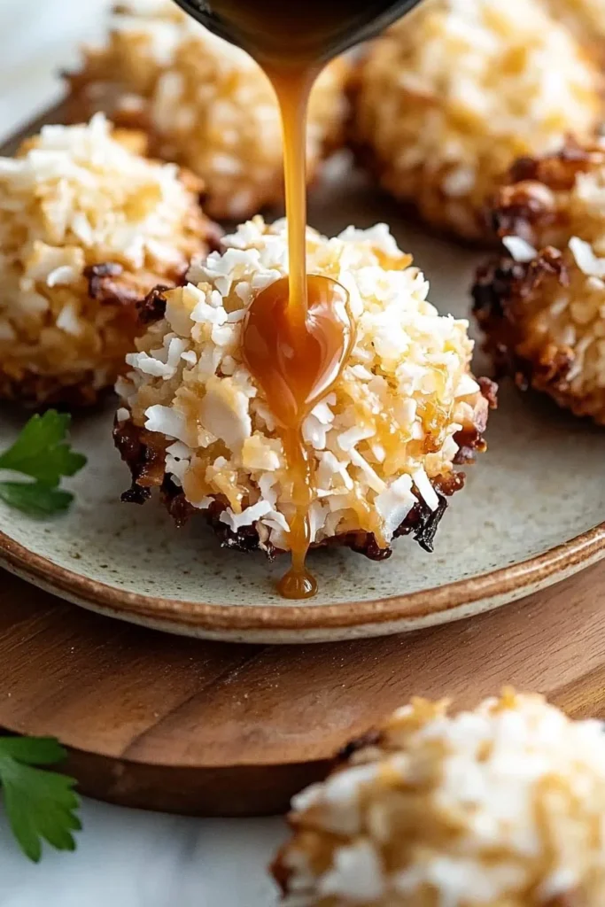 No bake salted caramel coconut macaroons on a plate garnished with caramel drizzle.