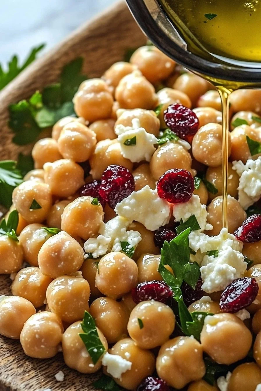 Feta and Cranberry Chickpeas salad bowl with fresh ingredients.