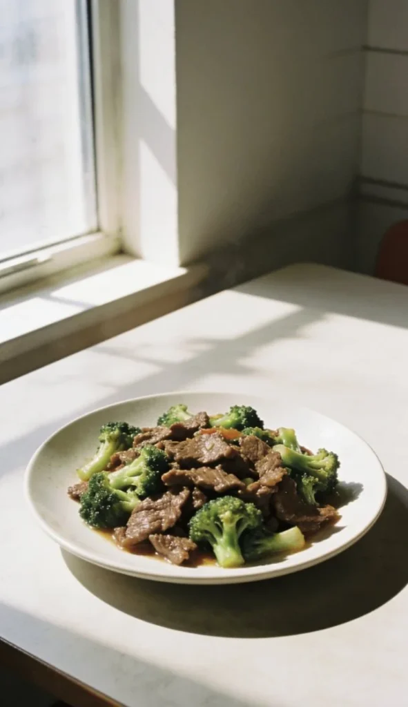 Delicious Beef and Broccoli Stir Fry served in a bowl garnished with sesame seeds.