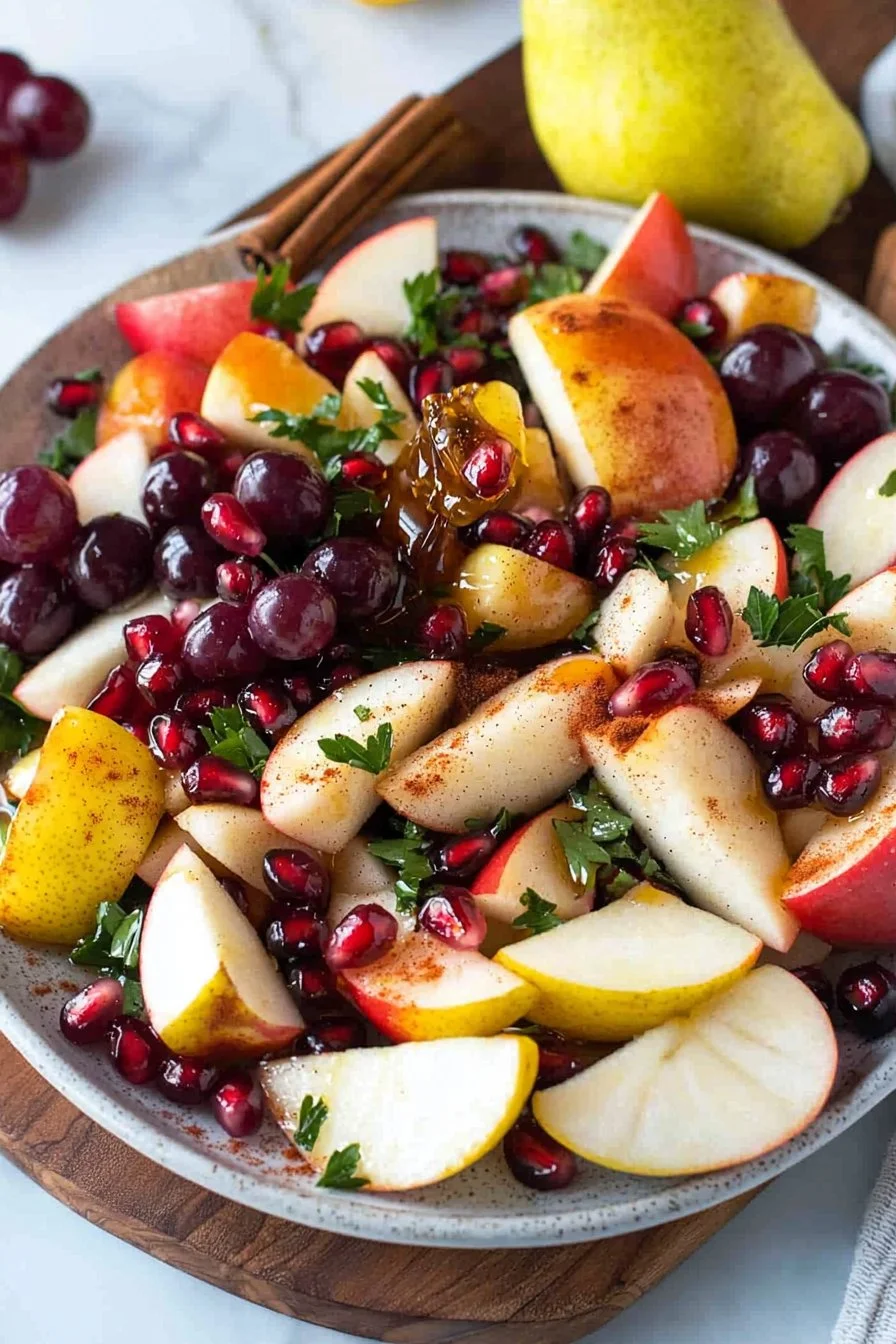 Colorful fall fruit salad with apples, pears, and seasonal fruits in a bowl.